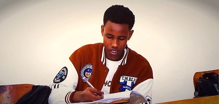 Atlas College student engaged in classroom lecture and coursework
